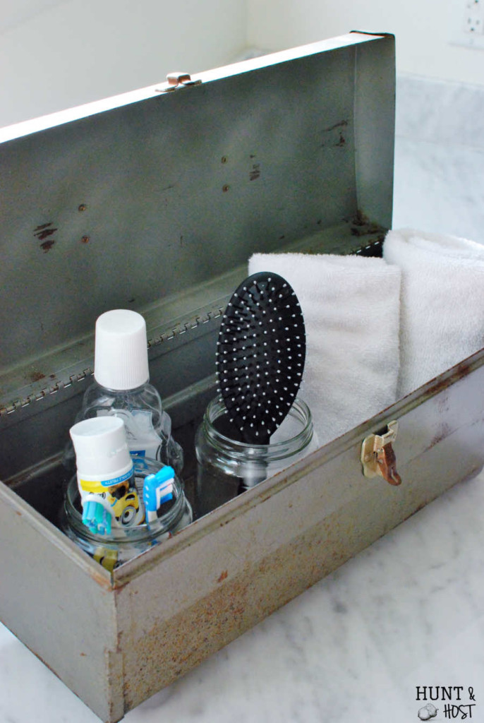 This rusty old toolbox gets a makeover into a boy's bathroom storage solution. www.huntandhost.net