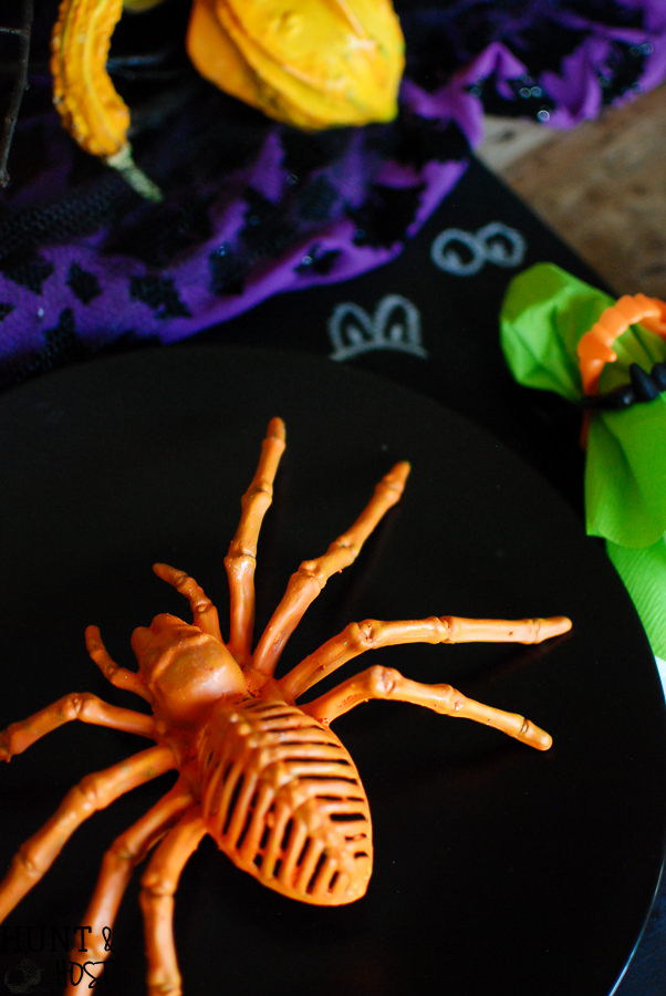 Dollar store crafts turn into a spooky fun Halloween table setting! Check out these easy and inexpensive Halloween ideas.