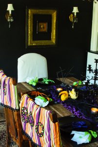 Dollar store crafts turn into a spooky fun Halloween table setting! Check out these easy and inexpensive Halloween ideas.