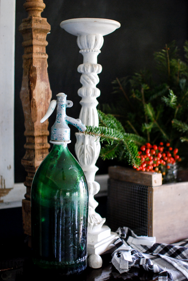 My Christmas farmhouse homes tour, featuring a sled centerpiece, vintage hat boxes, fresh cut greenery and pops of red and green.