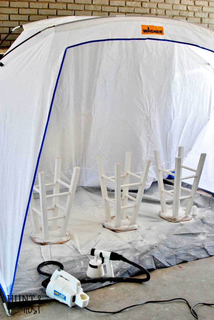 Cheap to chic bar stool makeover. See how quick and easy you can transform projects with a paint sprayer and tent. A paint spray tent provides protection and easy clean up for a messy painter like me.