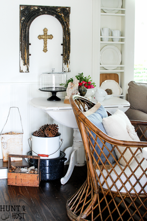 Kitchen cubbies get a makeover into a built in plate rack filled with gorgeous goodies like white and wood. White plates, cutting boards and antique tea and coffe pots. This simple DIY will help you transform small shelves into functional display space.