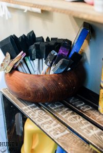 New crates get an old makeover with stain and stencils. Great for extra storage and organizing see an easy tip on how to hang crates without damaging them while still having them sturdy and straight.