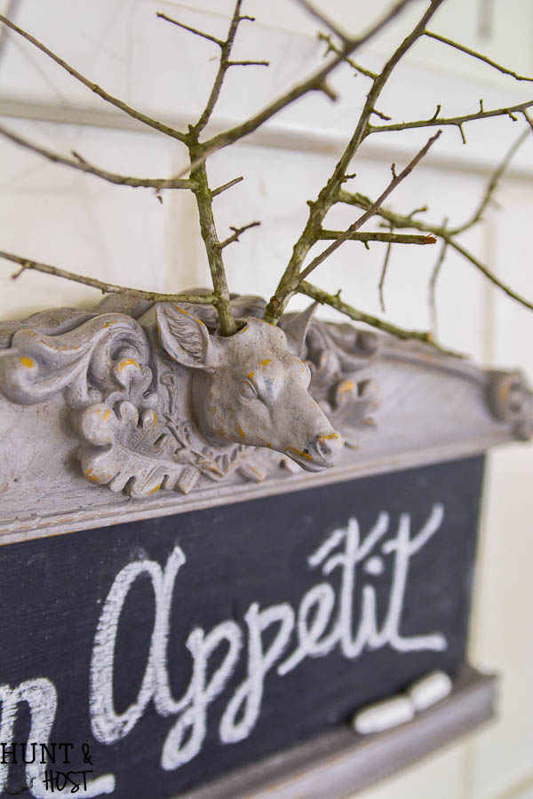 This thrifty find gets made into a creative chalkboard, when in doubt chalkboards always look great! This deer head has the cutest branch antlers!