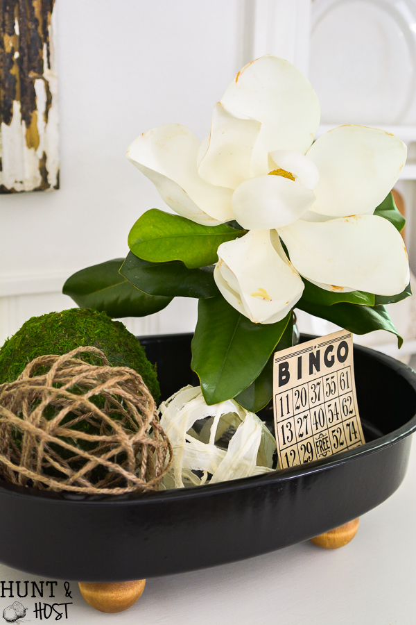 This old enamel pot lid without it's pot gets a makeover into a footed tray. Perfect for indoor or outdoor décor and the easiest DIY ever!