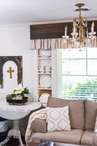 Make inexpensive custom curtains from old wood and dropcloth. Dropcloth curtains are soft and casual, rich wood is the finishing touch. Easy DIY curtain tutorial.