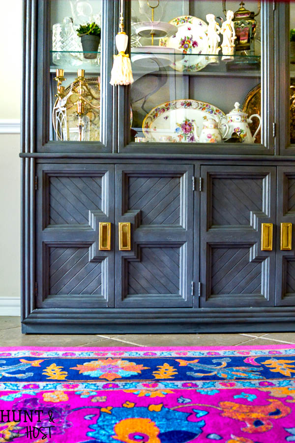 French Cajun dining room décor ideas inspired by Empress Dresden Flowers China pattern. Dining room ideas to including a gray painted china hutch and pink rug.