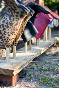 Do you have boot and shoes scattered everywhere? This easy DIY boot rack will take an afternoon to make and get those muck boots organized!