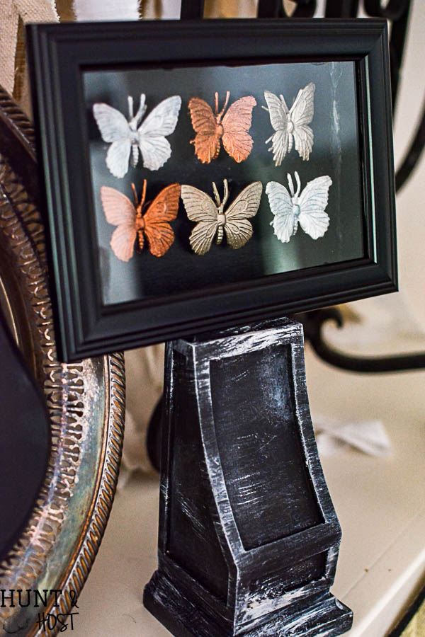 Halloween decorating ideas from the dollar store. These gilded bugs display cases are glamorous and easy to make Halloween décor.