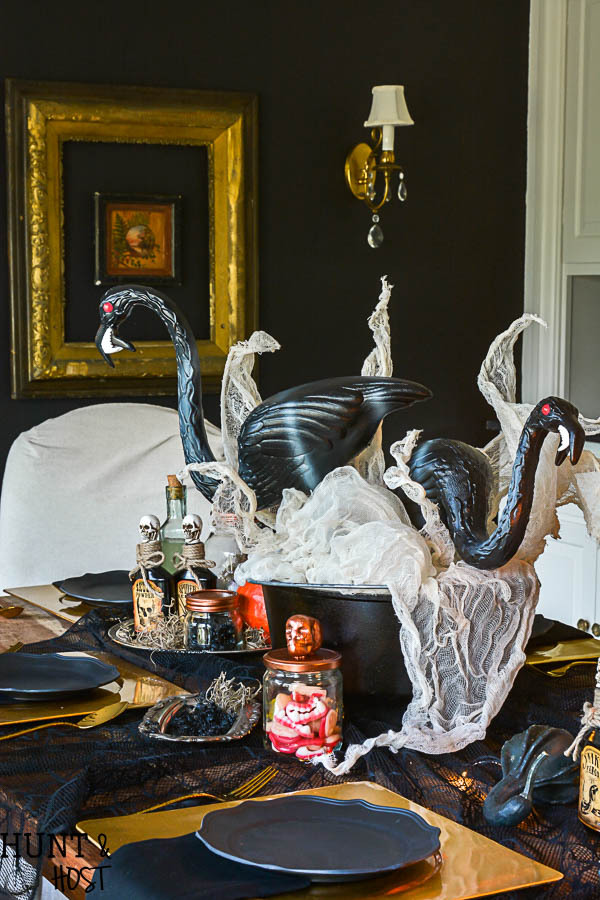 Halloween has gone glam! This crazy lady scientist glam Halloween table setting is so fun, full of fantastic Halloween decorating ideas and Halloween DIY. Featuring zombie flamingos being concocted! Plus Cost Plus World Market Halloween photo contest information.