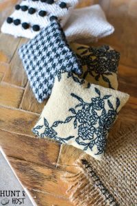 DIY dollhouse textile ideas. Cute dollhouse rugs, simple dollhouse pillow ideas and cute little DIY dollhouse curtains! Farmhouse style dollhouse accessories are easy and fun to make yourself! Part of the one room challenge!