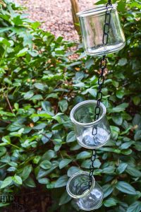 DIY rain chain tutorial, easy and inexpensive oui yogurt jar crafts. This rain chain makes a rainy day beautiful!