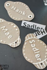 I want to make these cute DIY tin labels for organizing. Can you believe these are dollar store buckets - so many organizing ideas from the dollar store in this article!