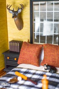 How precious is this rustic boys bedroom? These dollhouse bedroom ideas are perfect for the outdoor loving little boy, deer mount and all!