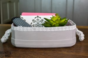 Turn your empty kitty litter jugs into cute storage buckets. Upcycling empty containers for inexpensive DIY organizing is quick and easy!