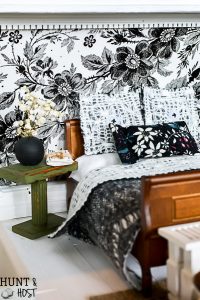 Get lost in in cozy comfort with these dollhouse master bedroom decor ideas. Large scale floral wallpaper make the room a dramatic room with vintage touches, you'll seriously want to move into this dollhouse bedroom! Vintage clocks on the fireplace mantel with a dramatic black and white theme.