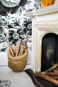 Get lost in in cozy comfort with these dollhouse master bedroom decor ideas. Large scale floral wallpaper make the room a dramatic room with vintage touches, you'll seriously want to move into this dollhouse bedroom! Vintage clocks on the fireplace mantel with a dramatic black and white theme.