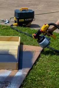 How to make a sleek potting table. This potting bench, painted black is a departure from the chippy white farmhouse look. Plus three must see ideas for professional and fast painted outdoor furniture with Wagner paint sprayers.