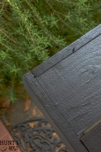 How to make a sleek potting table. This potting bench, painted black is a departure from the chippy white farmhouse look. Plus three must see ideas for professional and fast painted outdoor furniture.