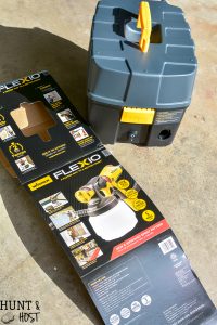 How to make a sleek potting table. This potting bench, painted black is a departure from the chippy white farmhouse look. Plus three must see ideas for professional and fast painted outdoor furniture with Wagner paint sprayers.