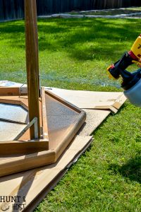 How to make a sleek potting table. This potting bench, painted black is a departure from the chippy white farmhouse look. Plus three must see ideas for professional and fast painted outdoor furniture with Wagner paint sprayers.