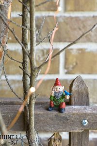 Take your fairy garden vertical with this natural fairy garden setting, complete with an actual fairy garden and swimming hole. This fun summer project to do with the kids will get your creativity going and green thumb working. Make a mini fairy garden for your house or porch with these precious fairy supplies and easy miniature ideas!