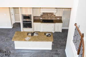Before pictures of a very vanilla builder grade home ready to get a personal and cozy makeover on a budget full of DIY ideas, tips and tricks. Follow along this cookie cutter home makeover!