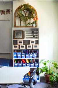 The cutest farmhouse classroom you ever saw. Visit this school room inspired by Magnolia Market and Joanna Gaines. It will have you wanting to pack a lunch and go back to school with it's fresh black and white decor and trendy farmhouse vibe. #farmhouseclassroom #farmhouselove #farmhouseinspiration #farmhouseteacher