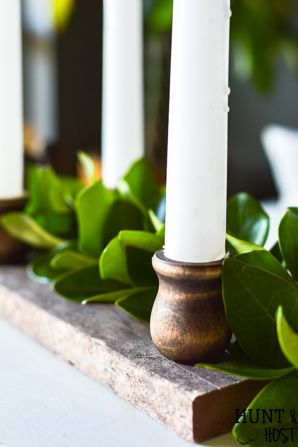 This DIY aged barn wood decor idea is so simple. Make a dual use tray out of DIY barn wood for a festive candle riser or gorgeous rustic centerpiece. #barnwood #barnwooddecor #barnwoodproject #candleriser #centerpieceidea