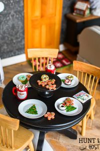 It's Christmas time in the dollhouse. Come see a dollhouse Santa, DIY stockings and miniature gingerbread. All the mini details of this holiday dollhouse are precious!