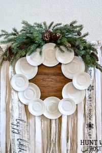 Make your own gorgeous wreath from vintage ironstone plates or hotel china. This DIY ironstone plate wreath tutorial is so simple and is perfect for vintage farmhouse decor. #ironstone #vintagewreath #roundtop #antiquesweek #wreathmaker