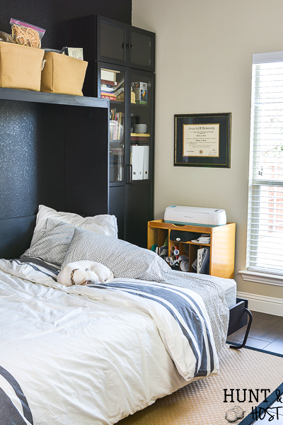 We added a Murphy bed to the craft room/guest bedroom and it is a space saver for sure. See how we paired the IKEA Billy bookcase with a custom Murphy bed for an office/craft/spare room with tons of functional storage and style. #IKEA #craftroom #murphybedidea #WhereWomenCreate #craftroomidea