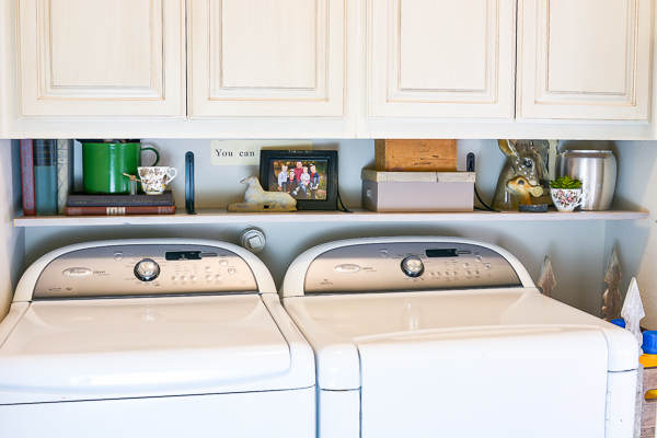 Here are a few simple DIY projects to organize your laundry room on a budget and keep you house clean this year - joyfully! Make your laundry room look beautiful and you will enjoy your time there more. Plus get the right cleaning tools to make your house cleaning easy, like the Bona spray mop that I am in love with. See how vintage items can cozy up a laundry room and create unique storage solutions for laundry room organization on a budget everyone can get behind. #laundryroom #organizationhack #diyorganization #bona