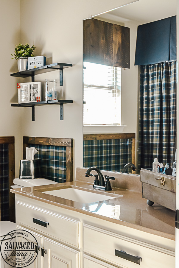 Decorating ideas for a small rustic bathroom. Perfect for a bunch ob boys and a casual cabin bathroom decor. With easy DIY open shelving and faux wall panels, there are some great bathroom decorating ideas here. #rusticbathroom #smallspaceideas #boysbathroom #fauxwallpaper #openshelving #shelfbrackets #DIYstorage #plaidwalls #rusticbathroomcolors #simpleideas