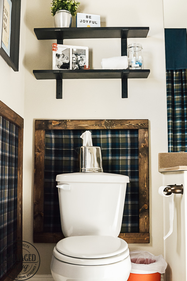 Decorating ideas for a small rustic bathroom. Perfect for a bunch ob boys and a casual cabin bathroom decor. With easy DIY open shelving and faux wall panels, there are some great bathroom decorating ideas here. #rusticbathroom #smallspaceideas #boysbathroom #fauxwallpaper #openshelving #shelfbrackets #DIYstorage #plaidwalls #rusticbathroomcolors #simpleideas