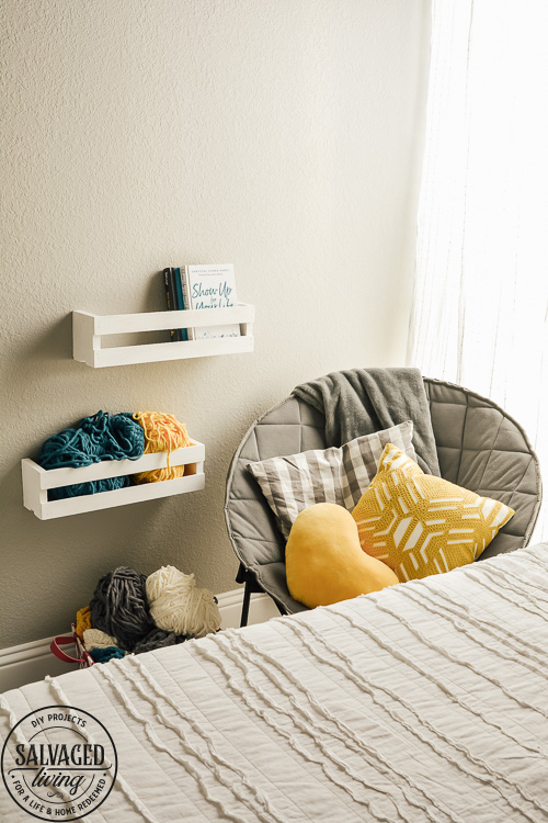 Design a cozy reading corner in your bedroom for a soft and dreamy retreat perfect for getting lost in a good book! Simple touches set the mood for this reading nook! #bookworm #readingnook #readingcorner #bedroomretreat #booknook #cozyreadingcornerforteens #DIYcurtains #bookshelf #cratefurniture