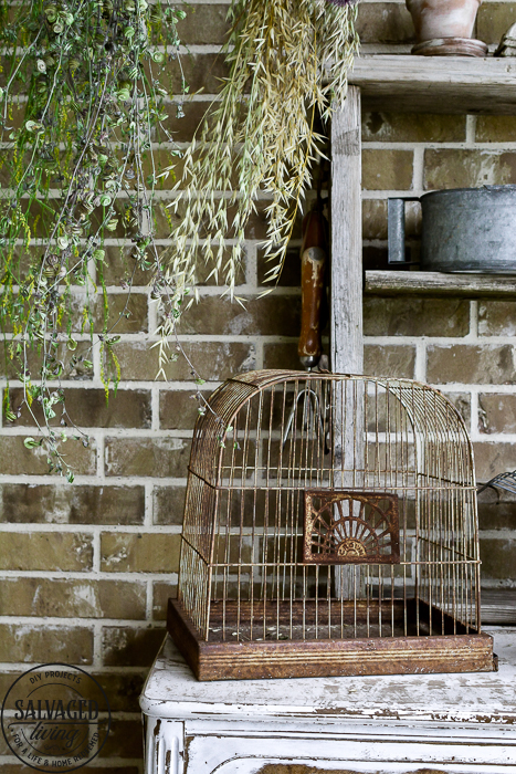 The perfect plant drying rack for your patio. If you want a French country feel on your porch then a vintage baby mattress spring is the best idea! Maybe you can even use it for a herb drying rack if you are a foodie! #herbdryingrack #diydryingrack #wildflowers #herbdrying #cozyporch #porchquilt