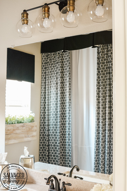 Steal some cozy black and white bathroom ideas to decorate you bathroom into a haven! The floor to ceiling shower curtain treatment and indoor window flower box are fabulous! #blackandwhitedecor #blackandwhitebathroom #teenbathroom #cozybathroomidea #showercurtainideas #DIYwindowbox #indoorwindowbox #tweengirldecorating