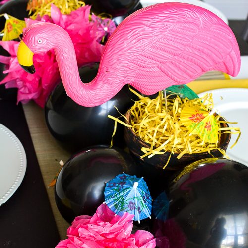 Good, cheap table decor for summer from the dollar store! Nothing beats a cute flamingo centerpiece and dollar store decor accents for an inexpensive kickoff to the summertime. See these creative DIY summer table ideas come to life from the 99 Cent Only Store! #dollartree #dollarstore #summertablescapes #summercenterpieces #simplesummer #flamingodecor #dollartreediy #flamingoparty