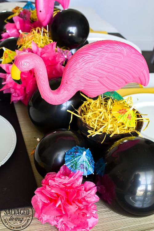 Good, cheap table decor for summer from the dollar store! Nothing beats a cute flamingo centerpiece and dollar store decor accents for an inexpensive kickoff to the summertime. See these creative DIY summer table ideas come to life from the 99 Cent Only Store! #dollartree #dollarstore #summertablescapes #summercenterpieces #simplesummer #flamingodecor #dollartreediy #flamingoparty