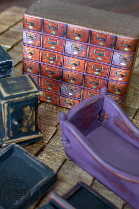 Progress on the creatin' contest miniature garden shed dollhouse. This tiny garden shed is coming along with fun details like a shingled dollhouse roof and upcycled display pieces from old drawers and broken furniture. Miniature crafting is so much fun, join me! #dollhouse #miniatures #gardenshed #miniaturegarden #minitureshop #miniaturecontest #dollhouseDIYideas