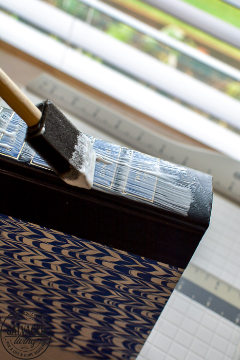 How to make gorgeous bookshelf decor in 30 minutes from old books. This book spine art project will have you making beautiful DIY home decor quick and easy. Book spine art is so easy and versatile. #bookupcycle #decorativebooks #bookshelfdecorating #DIYdecortutorial #vintageart #readersdigest #upcycle #repurpose