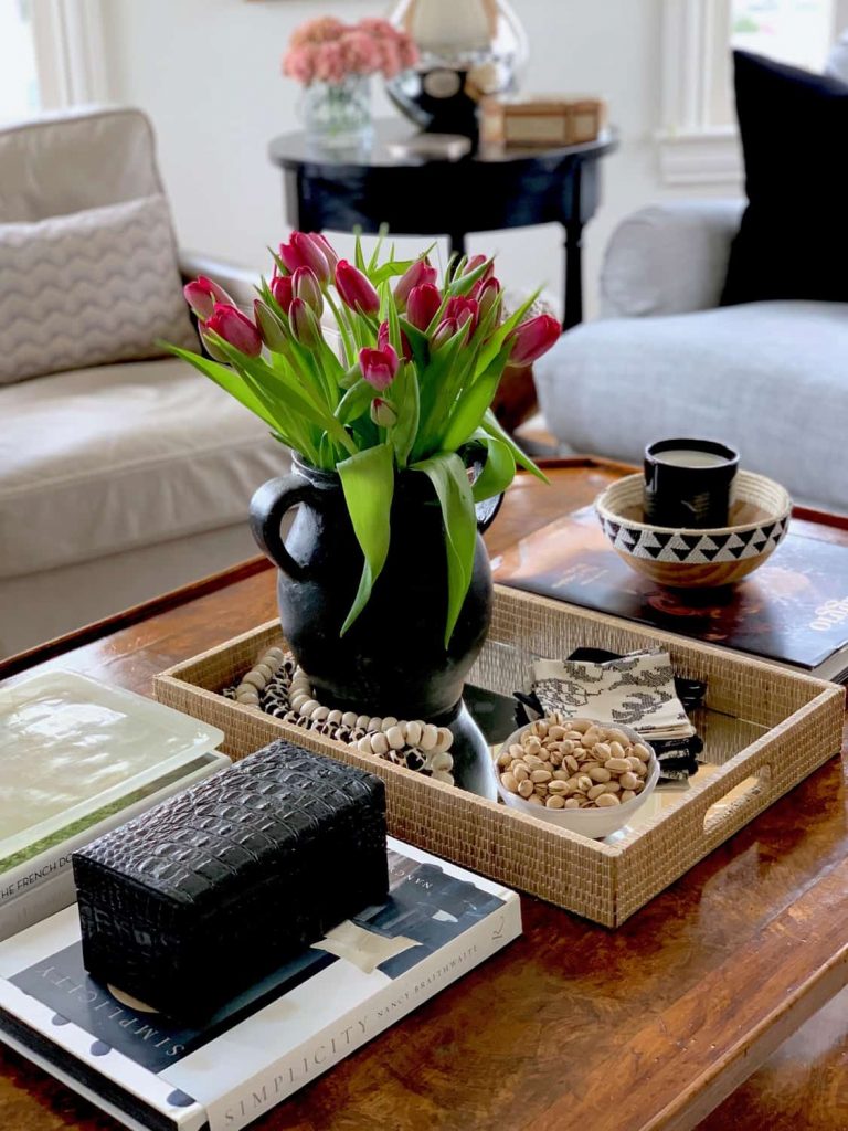 Grab these coffee table decor ideas for a cozy living room. This post is awesome, it has a list of must have elements for cozy coffee table styling plus a list of supply ideas for your cozy coffee table to be magazine worthy! #coffeetablestyle #coffeetabledecor #vignettestyling #decortips #decorating101 #decoratingtips #cozylivingroom #livingroomdecor #coffeetabledecorideas