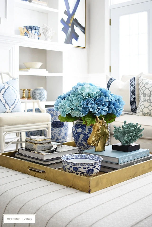 Grab these coffee table decor ideas for a cozy living room. This post is awesome, it has a list of must have elements for cozy coffee table styling plus a list of supply ideas for your cozy coffee table to be magazine worthy! #coffeetablestyle #coffeetabledecor #vignettestyling #decortips #decorating101 #decoratingtips #cozylivingroom #livingroomdecor #coffeetabledecorideas