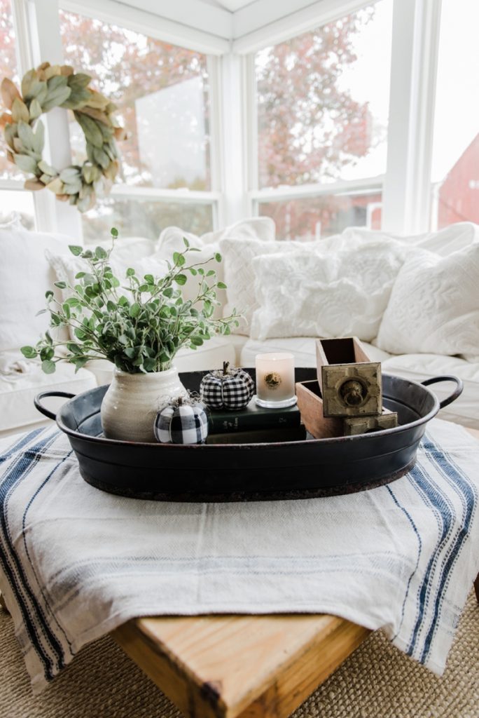 Grab these coffee table decor ideas for a cozy living room. This post is awesome, it has a list of must have elements for cozy coffee table styling plus a list of supply ideas for your cozy coffee table to be magazine worthy! #coffeetablestyle #coffeetabledecor #vignettestyling #decortips #decorating101 #decoratingtips #cozylivingroom #livingroomdecor #coffeetabledecorideas