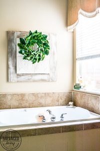 How to make wall art larger. Make sure you fill your walls with the correct scale artwork. This decorating idea will help you use what you have to make artwork that fits your space beautifully. #walart #decoratinghack #decoratingtip #DIYwallart #interiordecorting