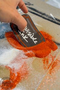 Learn how to emboss labels for Halloween apothecary jars. Learning an embossing technique with a heat tool is great to know for paper crafts, Halloween decor and a variety of crafting ideas. You will love these simple Halloween decorating ideas, many with items from the dollar store. To decorate for Halloween on a budget. #DIY HalloweenDecorations #heattoolprojects #heattoolideas