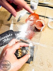 Learn how to emboss labels for Halloween apothecary jars. Learning an embossing technique with a heat tool is great to know for paper crafts, Halloween decor and a variety of crafting ideas. You will love these simple Halloween decorating ideas, many with items from the dollar store. To decorate for Halloween on a budget. #DIY HalloweenDecorations #heattoolprojects #heattoolideas