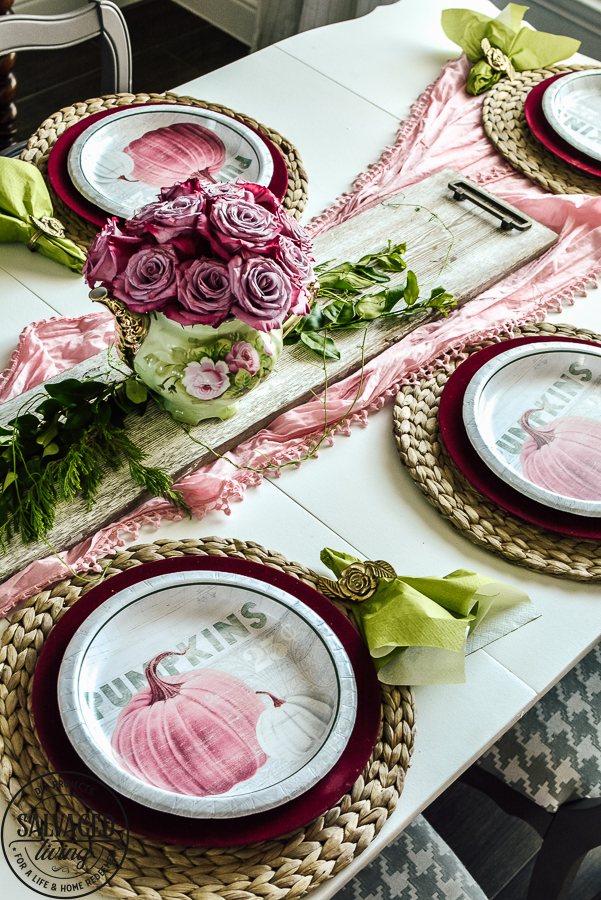 Get some great fall decorating tips on a budget with this elegant tablescape idea for fall. Plus see a ton of fall decorating ideas in the fall round up - you can get fall mantel ideas, beautiful fall wreath inspiration, fall sign ideas and more! #fallideas #budgetdecoratingforfall #budgetdecor #dollarstoretable #fall #dollartreedecor #pinkfall #gargesalefall #fallwreath #fallmantel #DIYfallsign