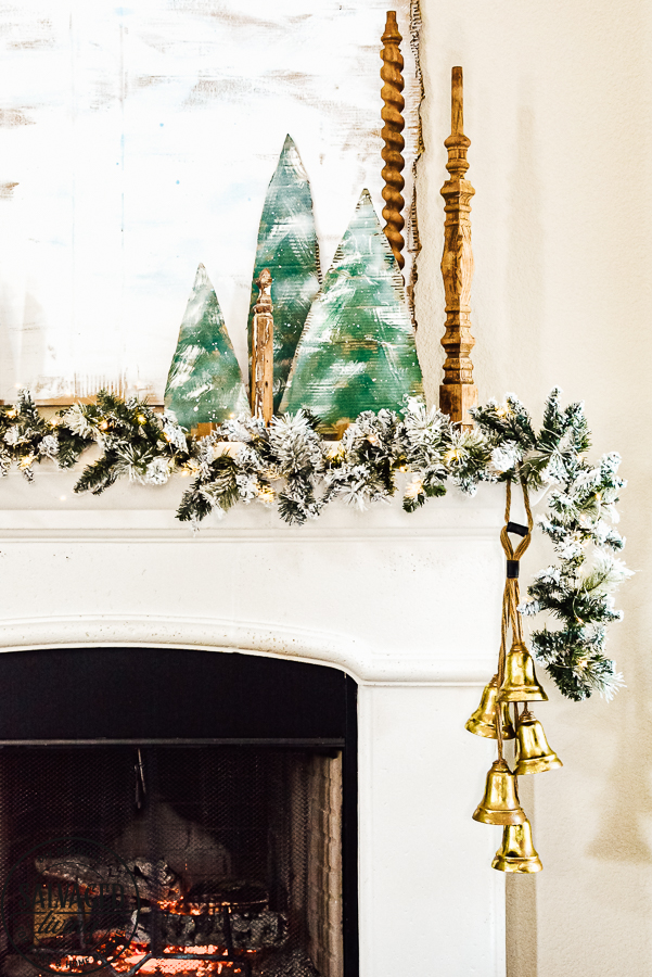 Decorate your mantel with these budget friendly ideas this Christmas! Plus I have a great tip on how to hang garland without nails for damage free decorating! This simple cardboard craft rounds out the Christmas fireplace decorations! #DamageFreeHolidayDecor #CommandDoNoHarm #cardboarddecor #fireplacedecor #vintageChristmas #budgetgarland #easyChristmasdecor 